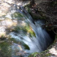 Water flowing down a hole in the ground