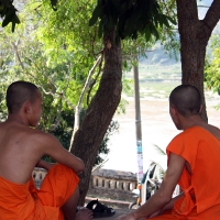 Two Monks relaxing by the river