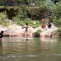 Children spear fishing